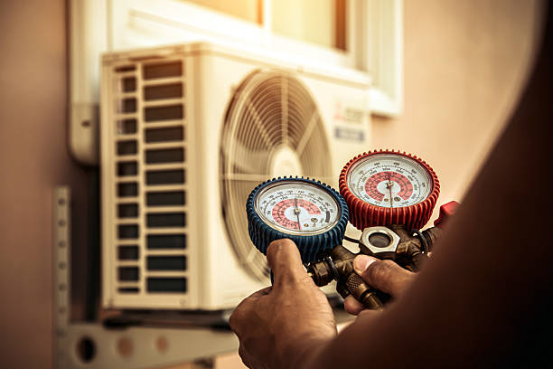 Professional Air Conditioning Service technician working in White Hall, MD